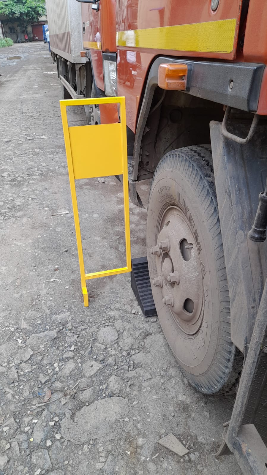 Truck wheel chock with metal stand